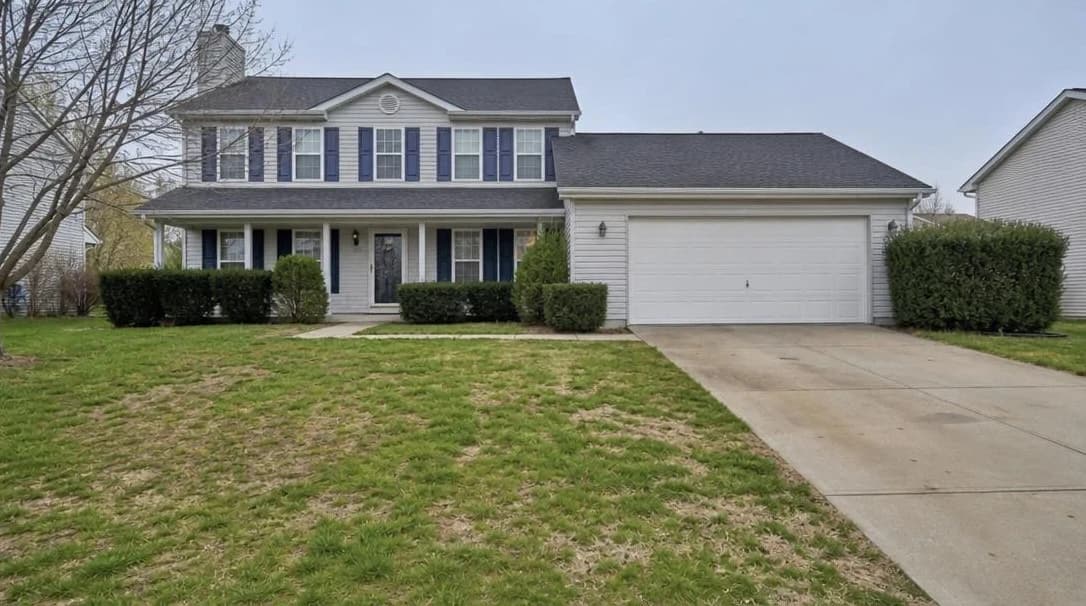 Property exterior with patchy, yellowed, or dead grass in the front garden